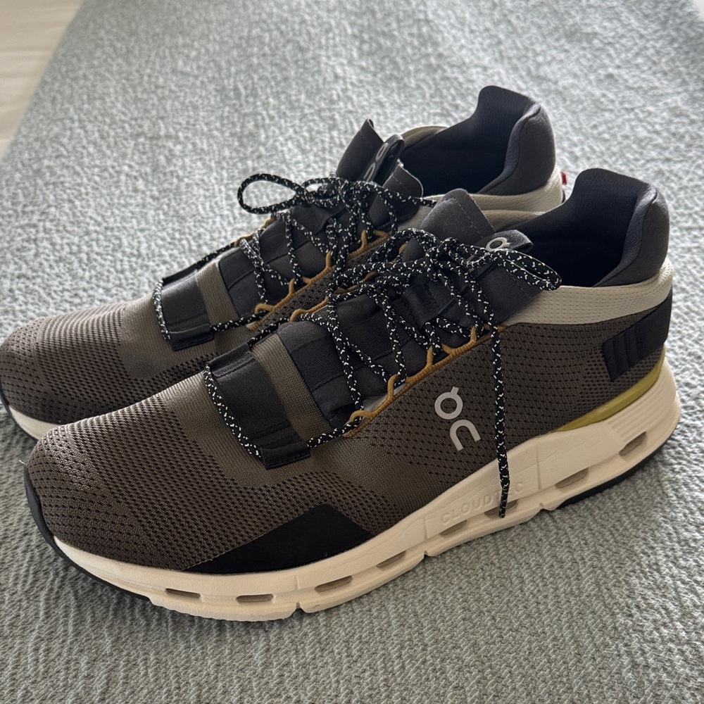 On Running Men's Black, Gray, and Gold Athletic Shoes